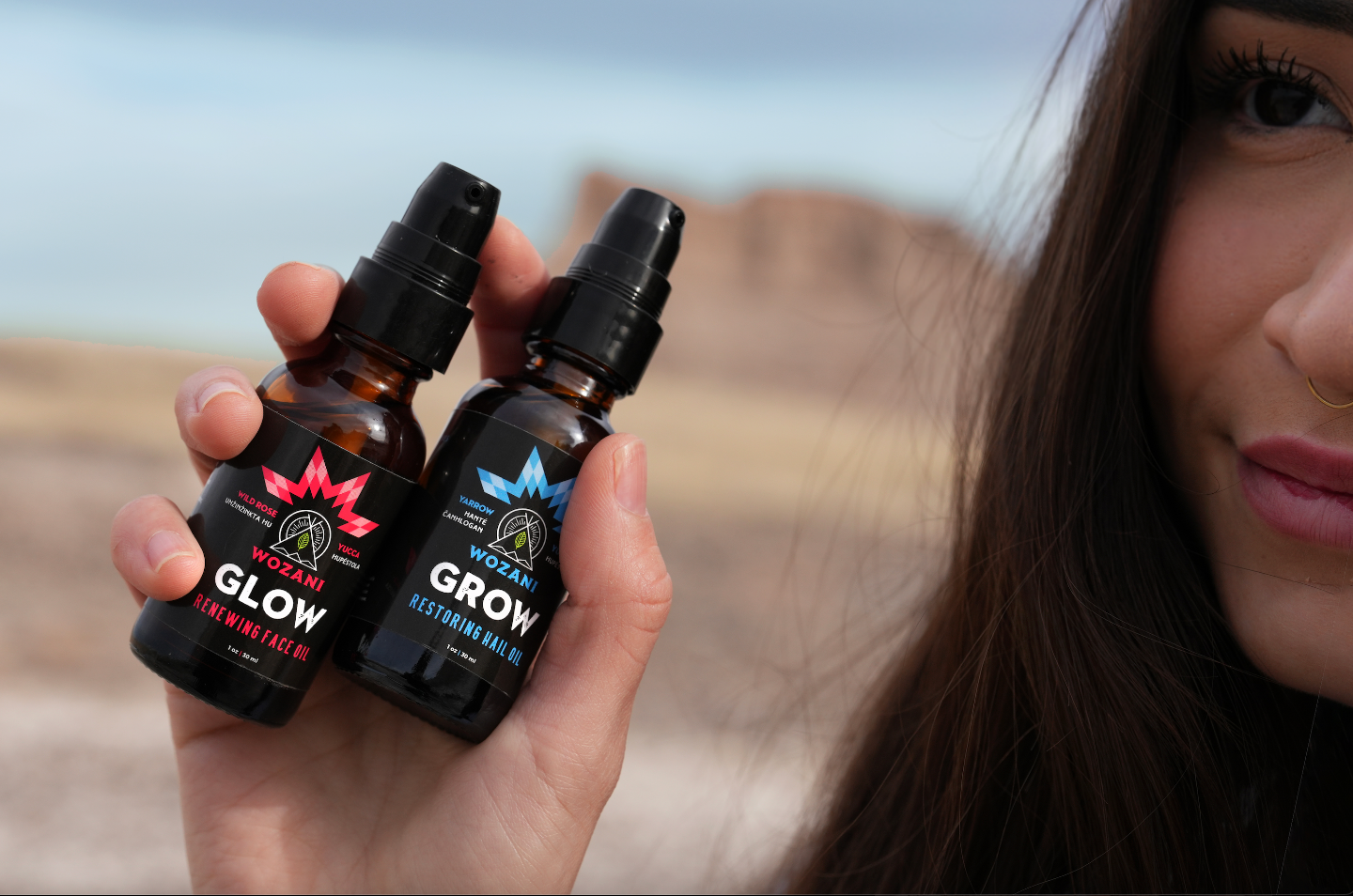 Beautiful native american girl holding wozani natural remedies for skin and hair health, grow and glow oils