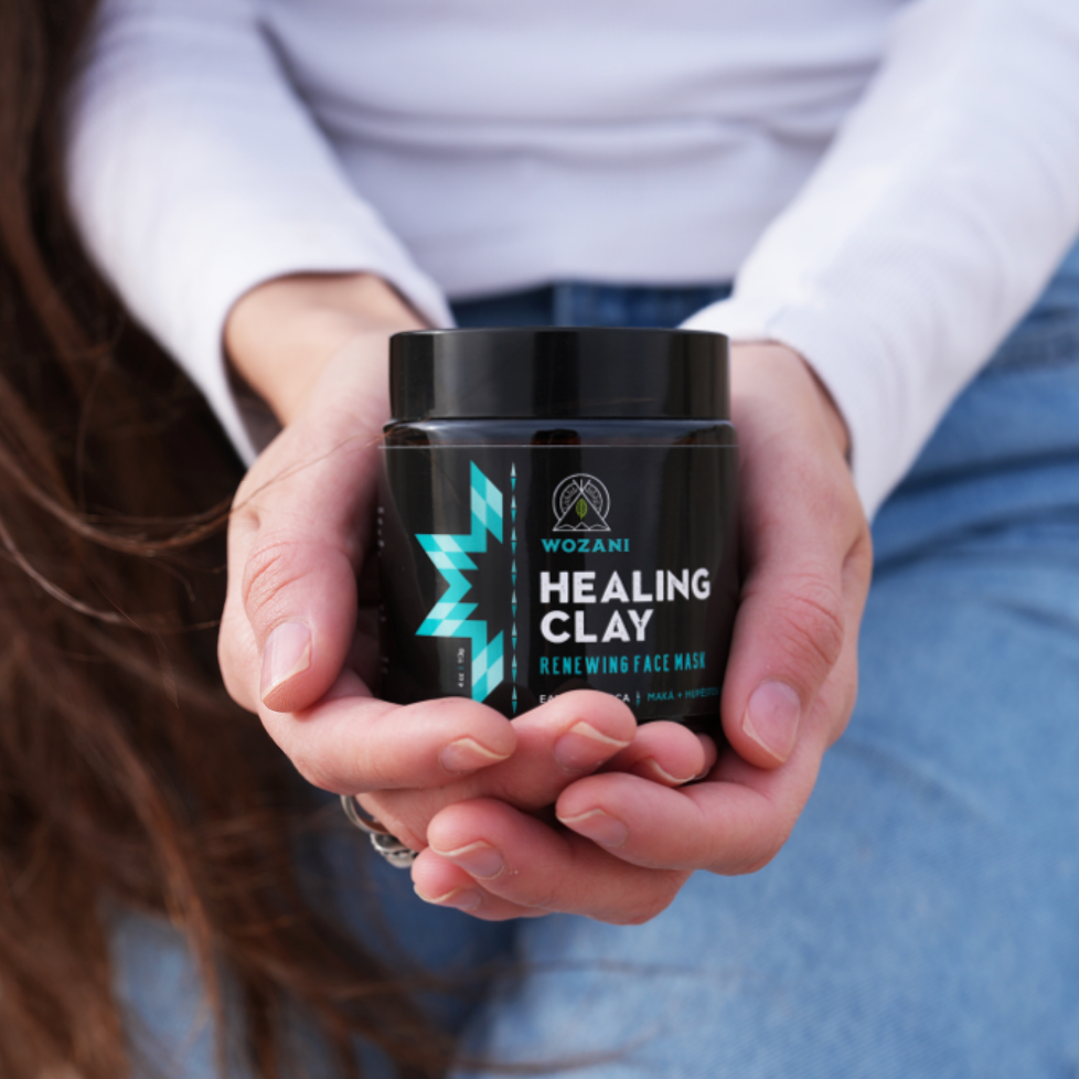 Hands holding Lakota Healing Clay face mask