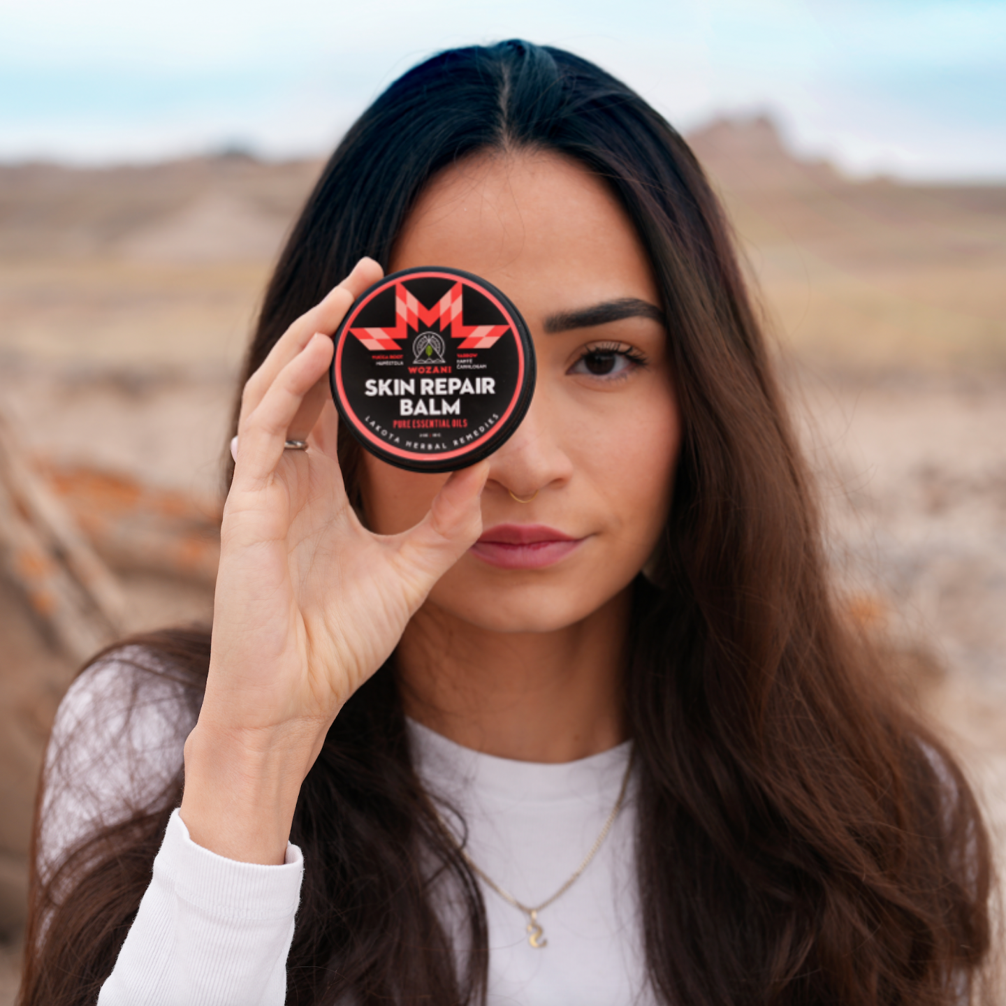 beautiful native american girl holding natural herbal remedy for skin